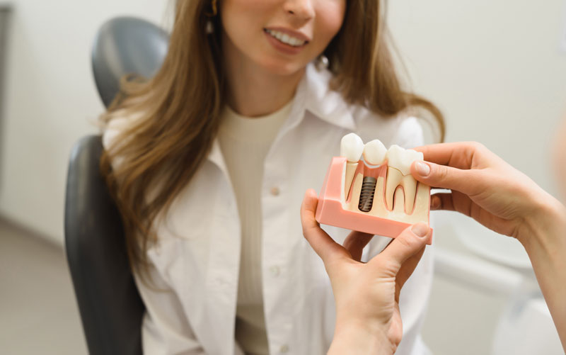 Discover a permanent solution for missing teeth with dental implants. Regain your confident smile and restore function. Learn more about implants now!