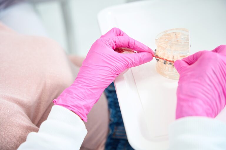 Patient cleaning dental implants while maintaining oral health in Fullerton CA